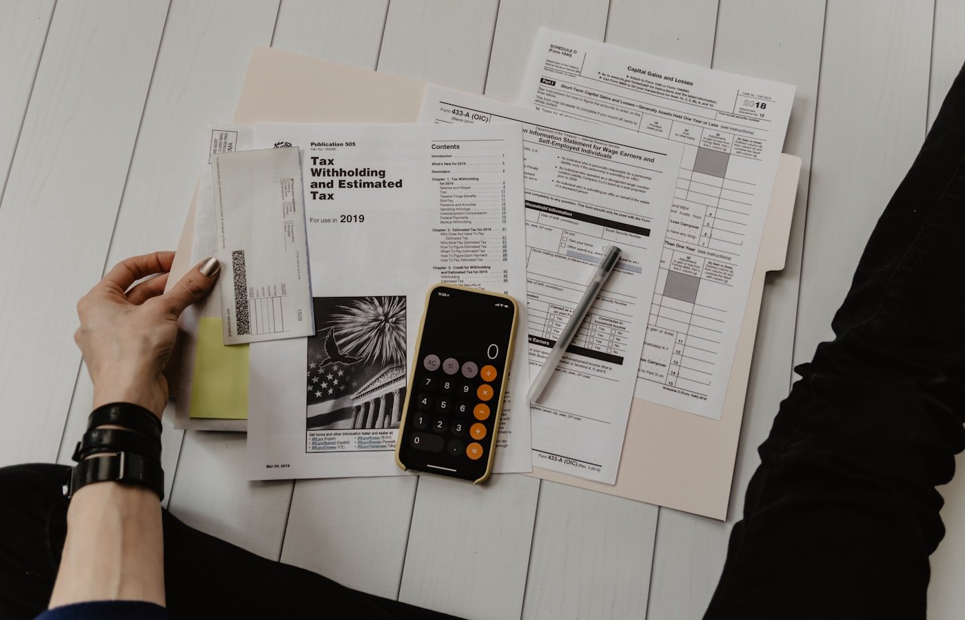 Corporate accountants and financial analysts reconciling enterprise general ledgers